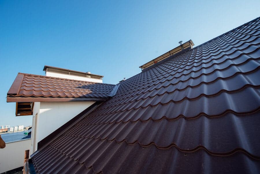 Titan Exteriors displays various roofing and metal roofing options in a city landscape Titan Exteriors displays various roofing and metal roofing options in a city landscape